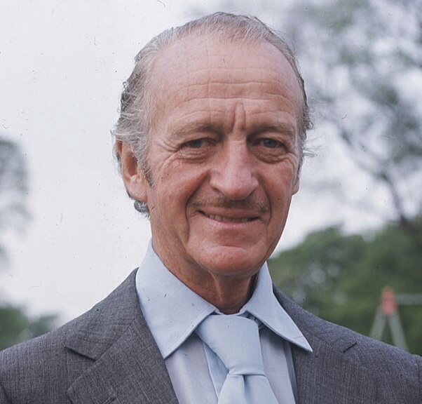 Actor David Niven aarrives at the Prince of Wales Theatre