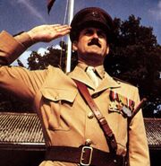 Major Giles Flack in Privates on Parade.