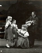 Louisa, Brigitta, Liesl and Captain von Trapp in The Sound of Music.