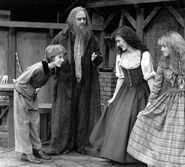 Fagin with Oliver, Nancy and Bet in Oliver!.