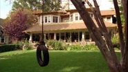 The front of the Duncan home with the tire swing in the front yard