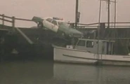 The police car crashing into the docks of Astoria.