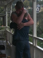 Mikey and Brand hugging after Mr. Perkins' visit to their home.