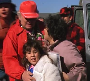 Chunk's mother, with her husband and daughter.