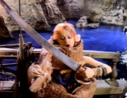 CyndiLauperOctopus.png (647 KB) Cyndi Lauper making sushi out of the octopus.