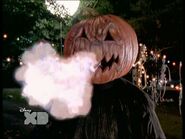 A Pumpkinhead breathing fire.