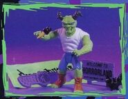 "Monster Bag" figure (comes with a plastic knife, "WELCOME TO HORRORLAND" sign, black ice cream and a bat).