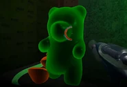 A green Gummy Bear chasing Twist.