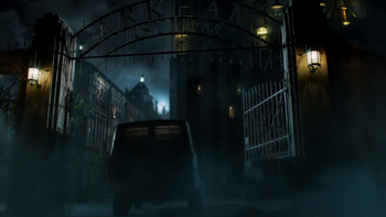 A bus driving into Arkham Asylum