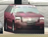 A maroon Cadillac Escalade as it appears in GT6 in the Brands Hatch track, also note of the small black color leftover on the car's front bumper from GT5P.