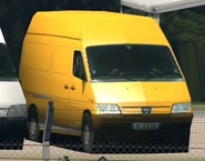 The Peugeot Boxer scenery car in GT6. Aside from the mesh body change, this version has a front logo on the car, this version of the scenery car later appears in GT Sport, with the logo of the car removed to be consistent with other scenery cars, the Mid-Field Raceway variant of this car would get added to the Autopolis International Racing Course Track Layouts in the 1.34 Update, however on only said track.