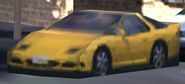 A yellow version of the Mitsubishi GTO trackside prop car as it appears in GT5 and GT6 in the Nürburgring tracks.