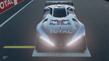 A Peugeot L750R with a default livery being used in a Sport Mode event; note the hood car number position partially obscuring the Red Bull logo.
