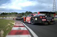 A Nissan MOTUL AUTECH GT-R (SUPER GT) '08 is right behind her sister teammate Nissan XANAVI NISMO GT-R (SUPER GT) '08 at the Suzuka Circuit.