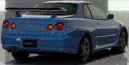 The Nissan SKYLINE GT-R M • spec Nür (R34) '02 as viewed from the rear. Notice the "M-spec Nür" badge below the right taillights.