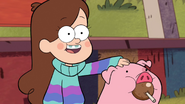 Mabel petting Waddles with a Caramel Apple in his mouth.