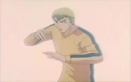 Onizuka cosplaying as Bruce Lee.
