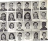 You can see when he's the kid with the longest hair. (3rd grade class)