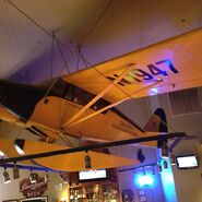 The plane hanging from the ceiling inside the restaurant