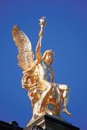 Golden Statue of Eros (Identifiable by the tourch in his hand)