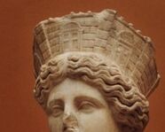 Rhea was often depicted wearing a crown especially when the statue was created with her on a throne.