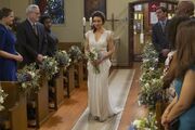 Amelia walks down the aisle.