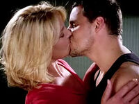 Alex and Izzie kiss.