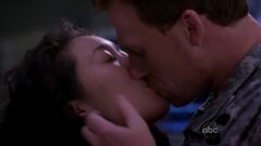 Cristina and Owen kiss.