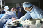 Meredith shields a patient during an earthquake
