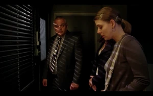 Detective Lampert (left)