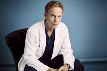 Greg Germann as Tom Koracick