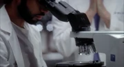 Dr. Russell examines samples from Janell Barnett's ovary.