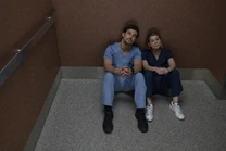 Andrew and Meredith are stuck in the elevator