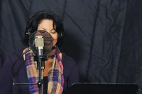 Sara Ramirez recording song for music event