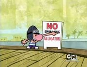 Billy reading the NO SWIMMING sign in Hog Wild