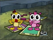 A yellow Hokeymonster and a purple Hokeymonster