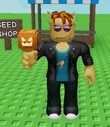 A player holding the Pumpkin Lollipop.