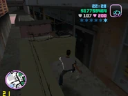 The wall blocking the alley.