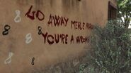 Writing on the back wall, telling Merle to go away, and that he is a "wrong 'un", British slang for someone who has a screw loose.