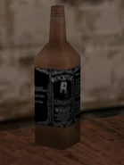 A liquor bottle featuring the logo.