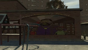 Граффити на общественном центре западного Бохана. Наверху граффити находится надпись "St. Mary's Community Project", что в переводе означает "Общественный проект Святой Марии". Это проект Мэнни Эскуэлы, цель которого — избавление улиц Бохана от преступности