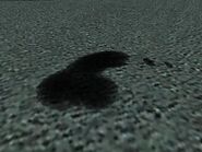 Une des taches d'huile en forme de pénis disséminées sur la piste d'entraînement de l'école de conduite dans GTA San Andreas.