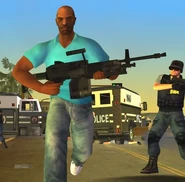 Victor Vance running with an M249 in Grand Theft Auto: Vice City Stories.