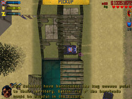 After collecting it, Billy Bob tells Claude to park it in front of the barricade blocking access to the Zaibatsu Village.