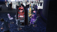 At a slot machine at the rear of the casino.