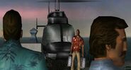 Tommy Vercetti and Harry walking towards Victor Vance, with Lance Vance sitting in the Maverick helicopter.