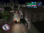 Tommy Vercetti attacks a Police car with a Hunter in Grand Theft Auto: Vice City.