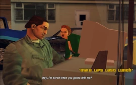 After Claude enters Joey's Garage, he sees Misty and Joey talking.