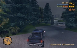 Claude drives towards the gate after stealing the Cartel Cruiser for extra cover.