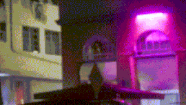 An animated GIF of the cabriolet driving down the Ocean Drive-inspired road in Vice Beach.